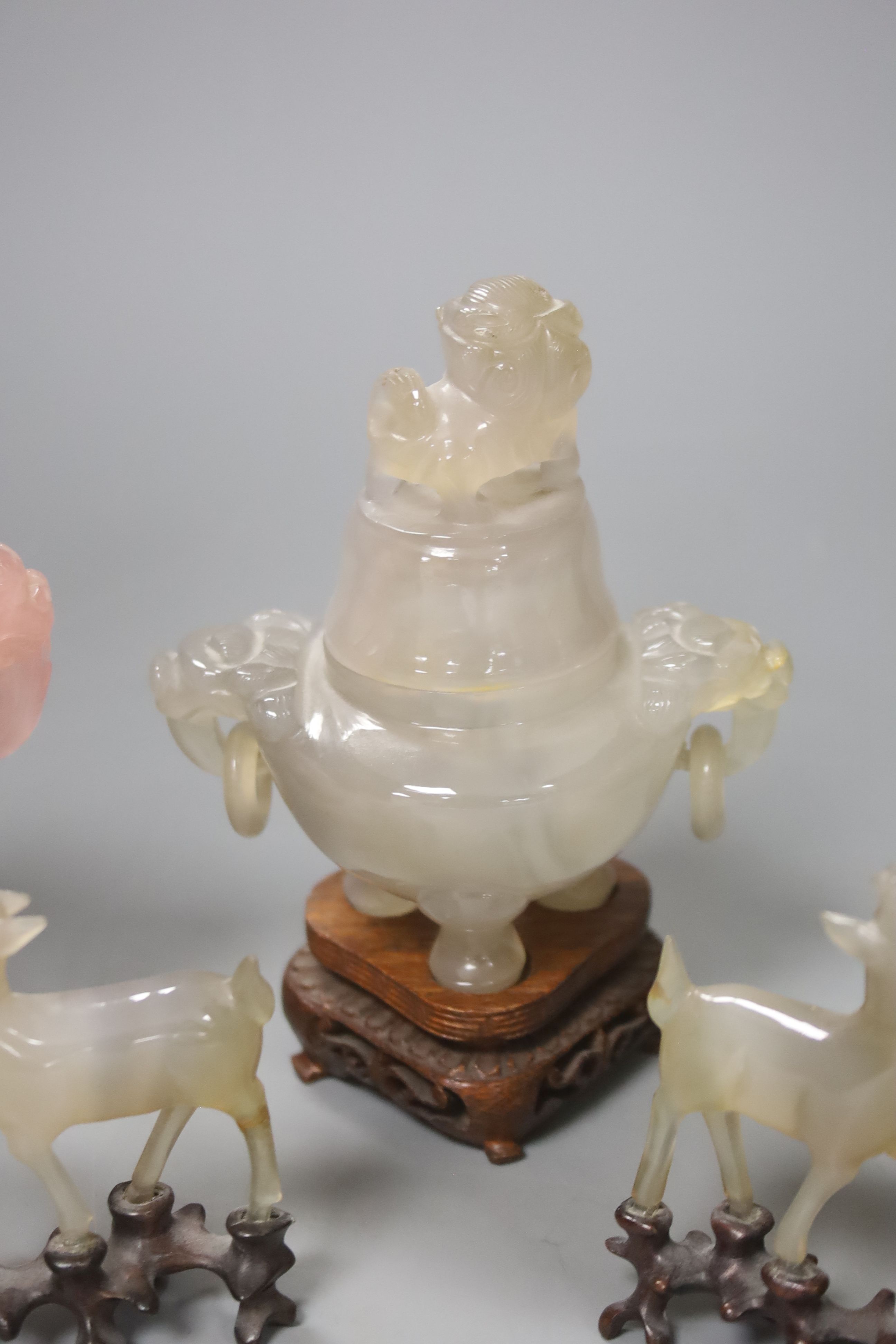 A Chinese rose quartz censer and cover on stand and four other items, including two further hardstone censers and covers and two small models of deer (5)